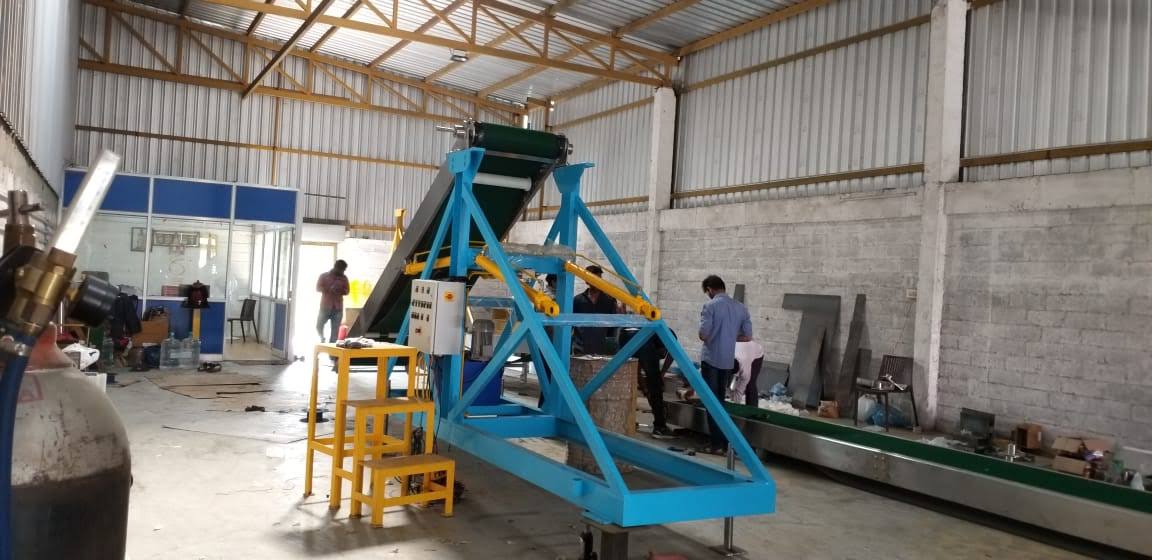 Semi-automatic bagging machine and take-away conveyor under fabrication