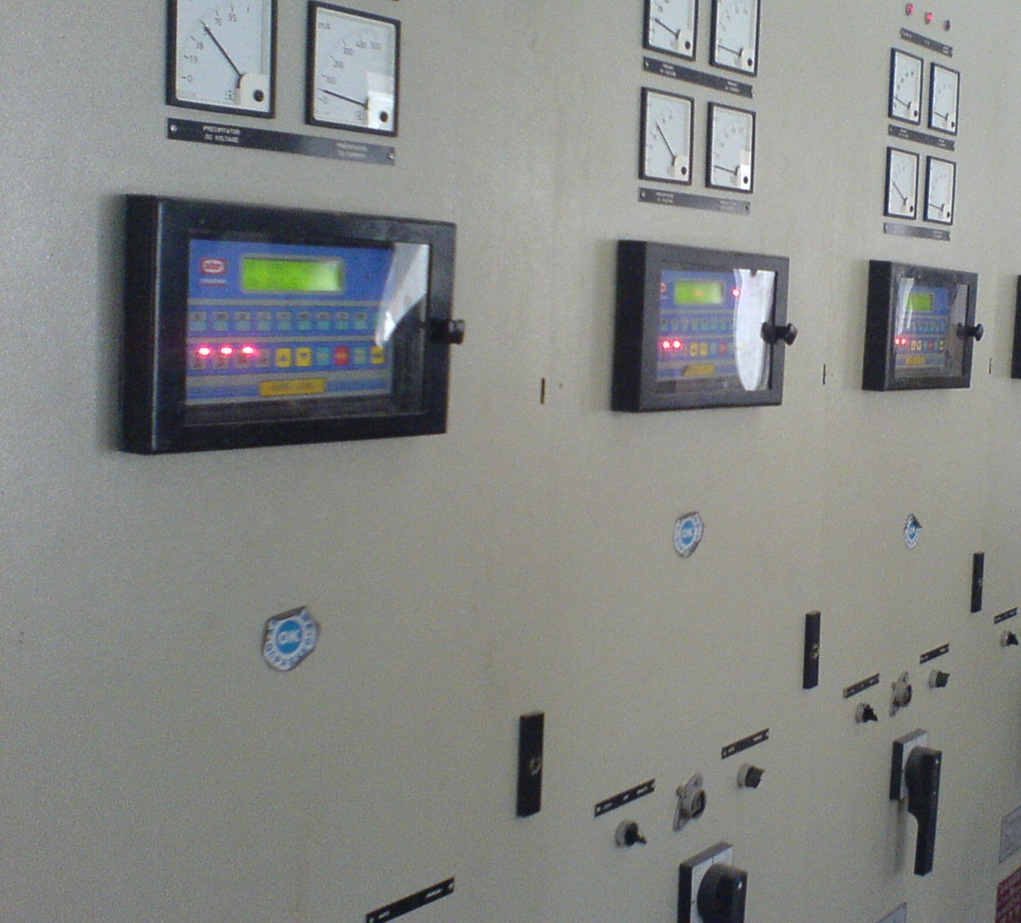 ESP control room with a row of control cabinets, panel metering and automatic voltage controllers