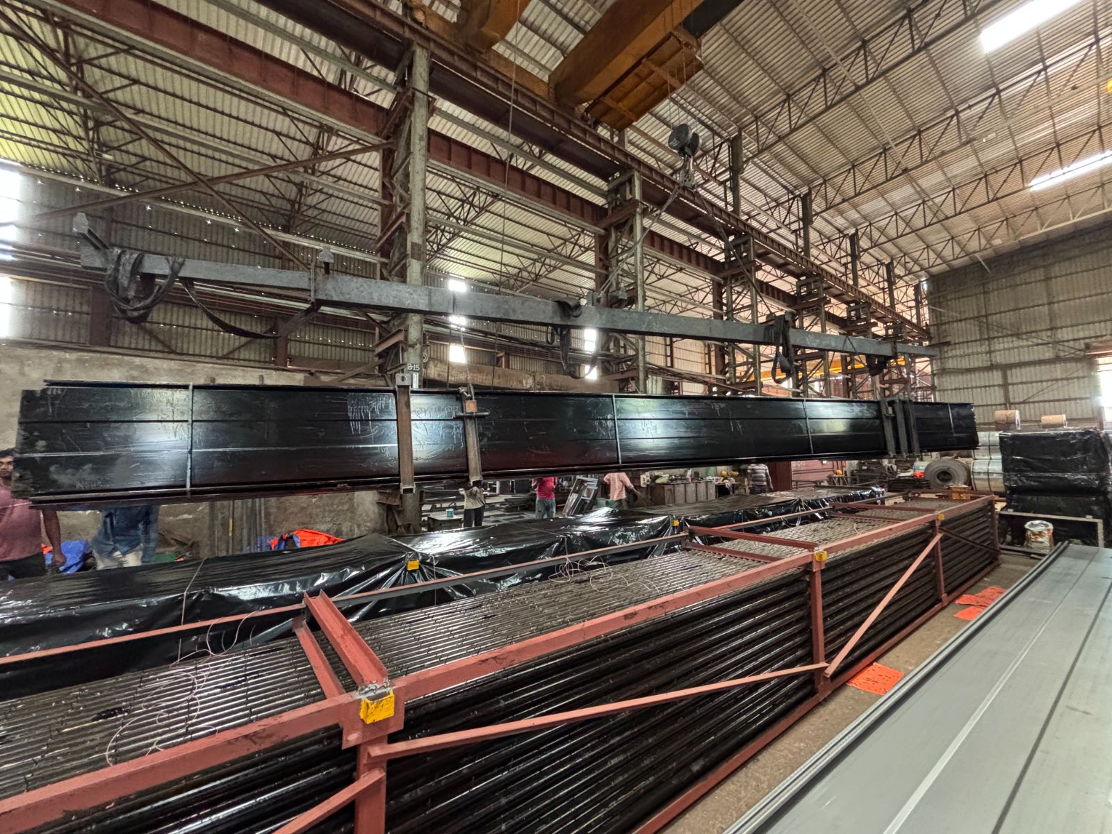 Assembled collecting electrode bundle lifted on a spreader beam prior to packing and despatch