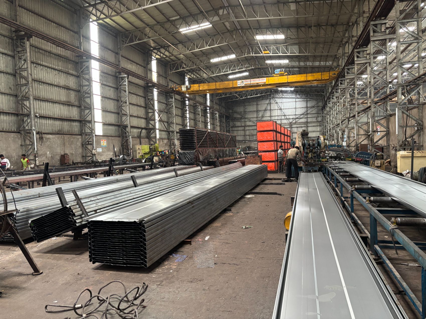 Formed collecting electrodes stacked alongside the roll forming line on the shop floor