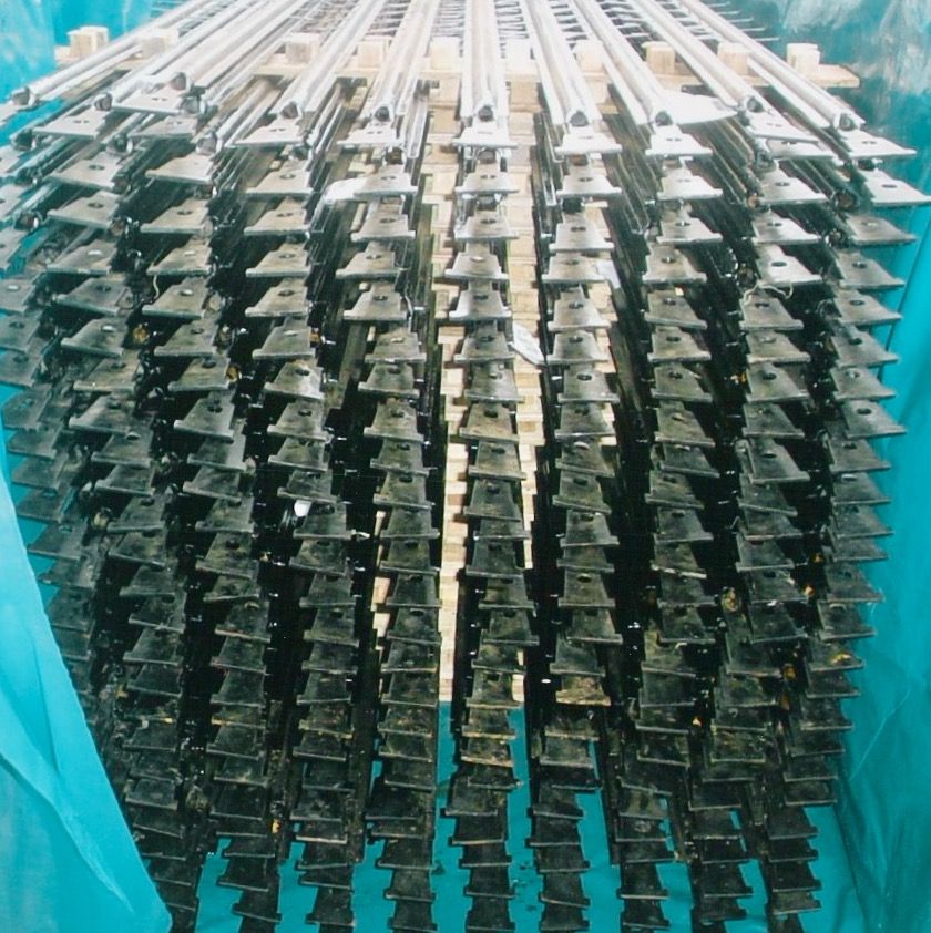 Discharge electrodes packed with saddle supports prior to despatch