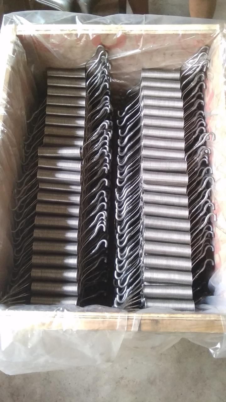 Spiral discharge electrodes with formed hook connection ends, packed in a crate for despatch