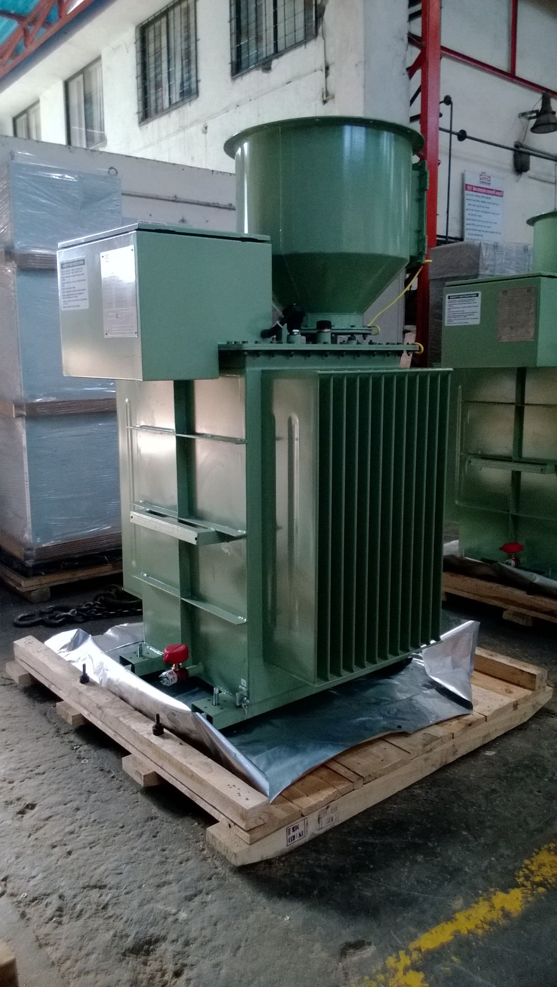 ESP transformer rectifier set crated on a pallet with conservator and radiators, prior to despatch