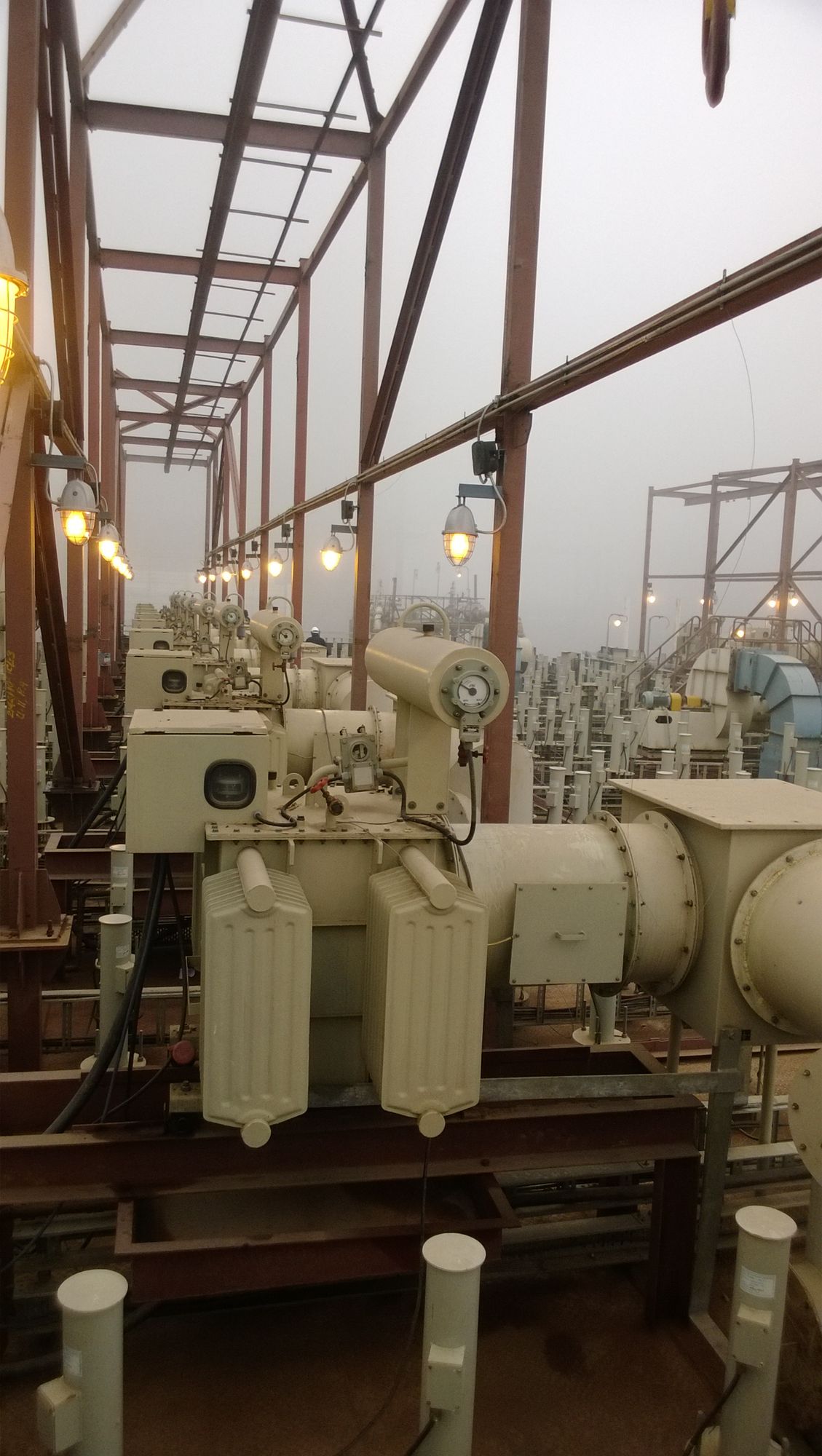Transformer rectifier sets installed on an ESP roof with insulator housings behind