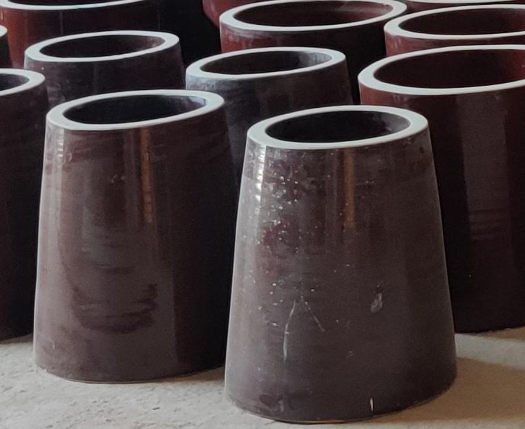 Conical hollow ceramic support insulators