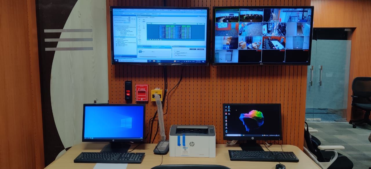 Operator position with a monitoring application and a multi-camera CCTV view on wall mounted displays