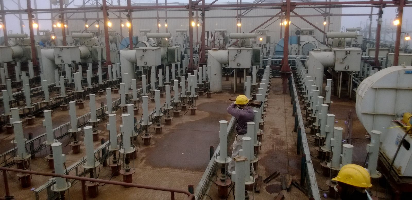 Rows of MIGI rapper coil housings installed across an electrostatic precipitator roof