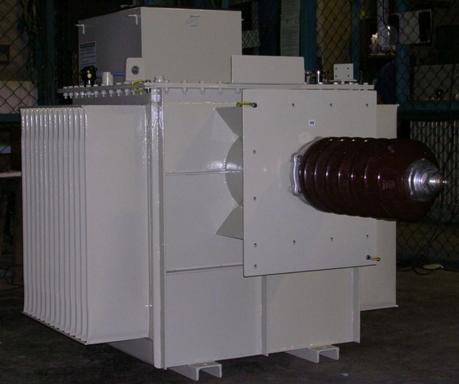 Single phase ESP transformer rectifier set showing the complete unit with HT bushing, radiator bank and control cabinet