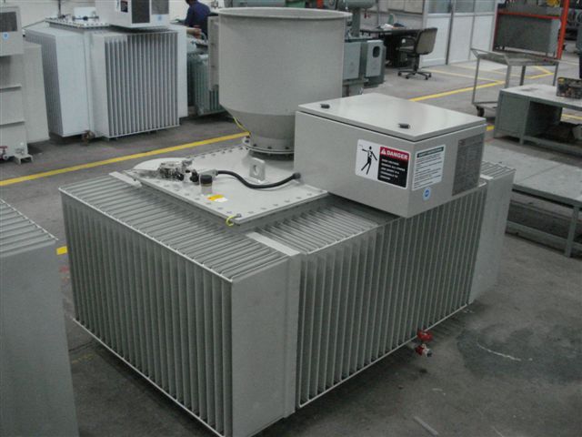 Three phase ESP transformer rectifier set with radiators and high-voltage bushing